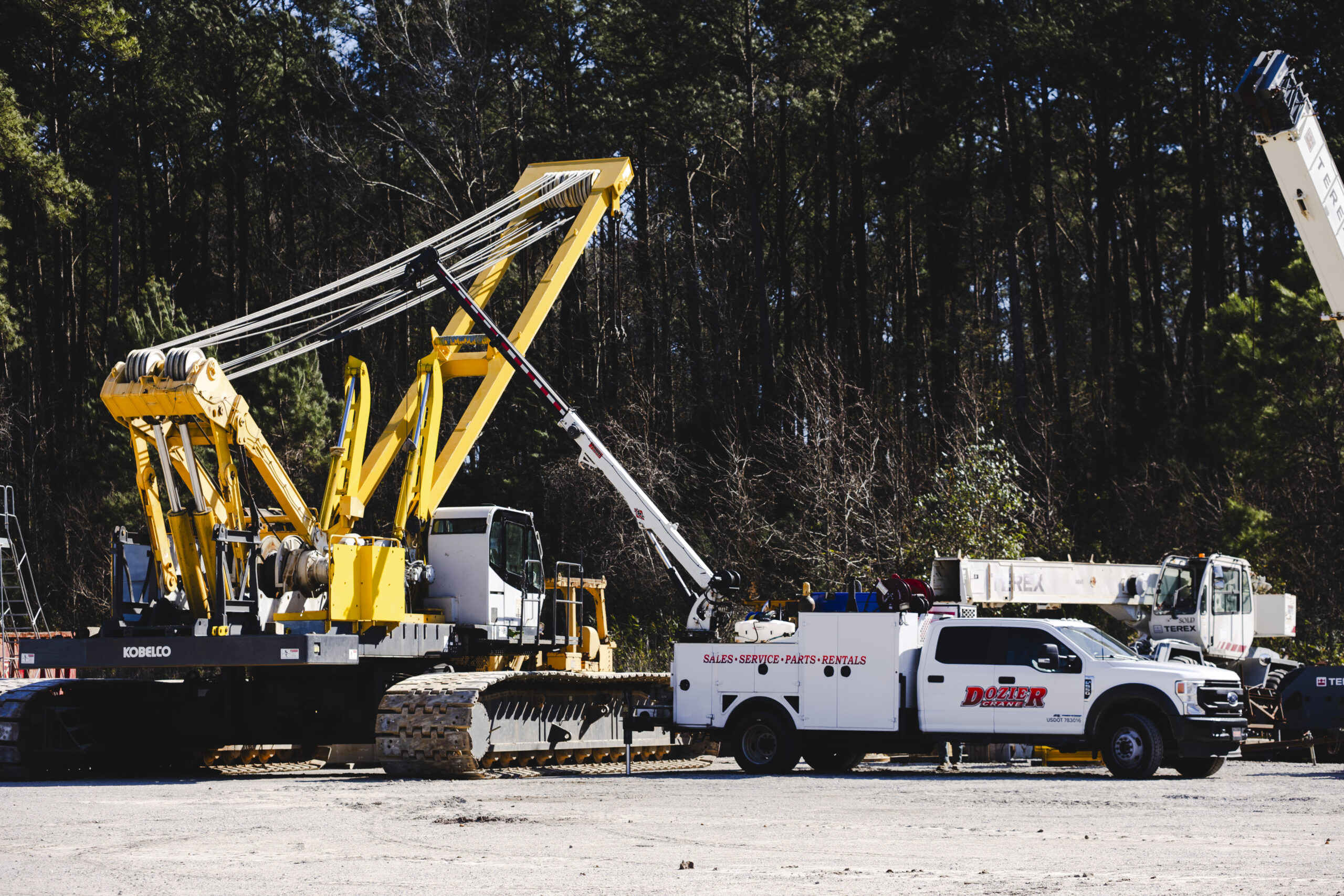 Dozier crane emergency services and repair equipment working on broken crane at construction site