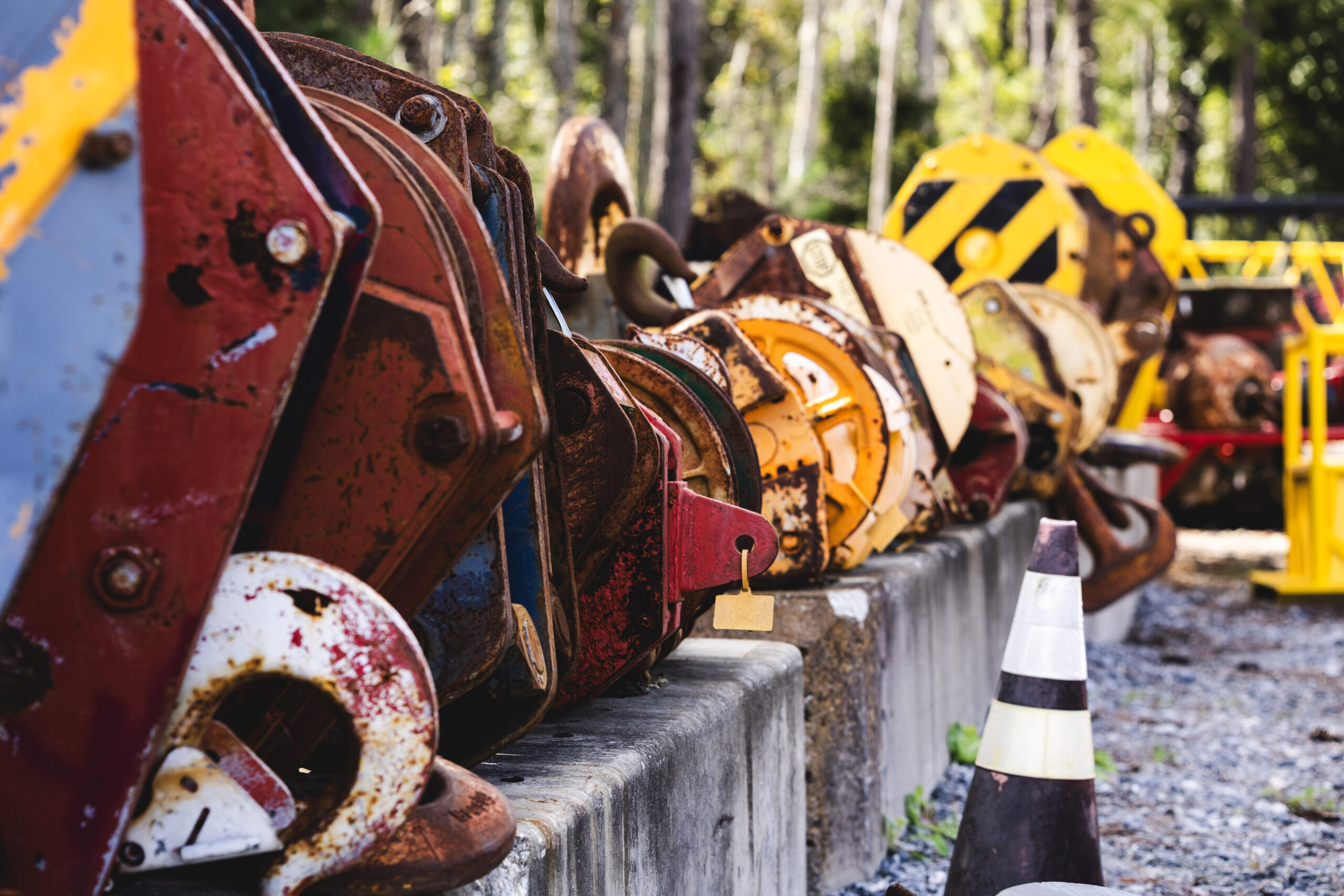crane parts lined up on concrete barricades in the crane yard at Dozier Crane