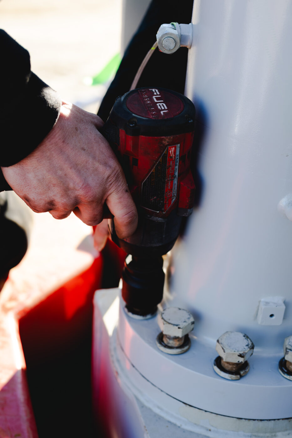 Dozier Crane employee using heavy equipment to repair a crane