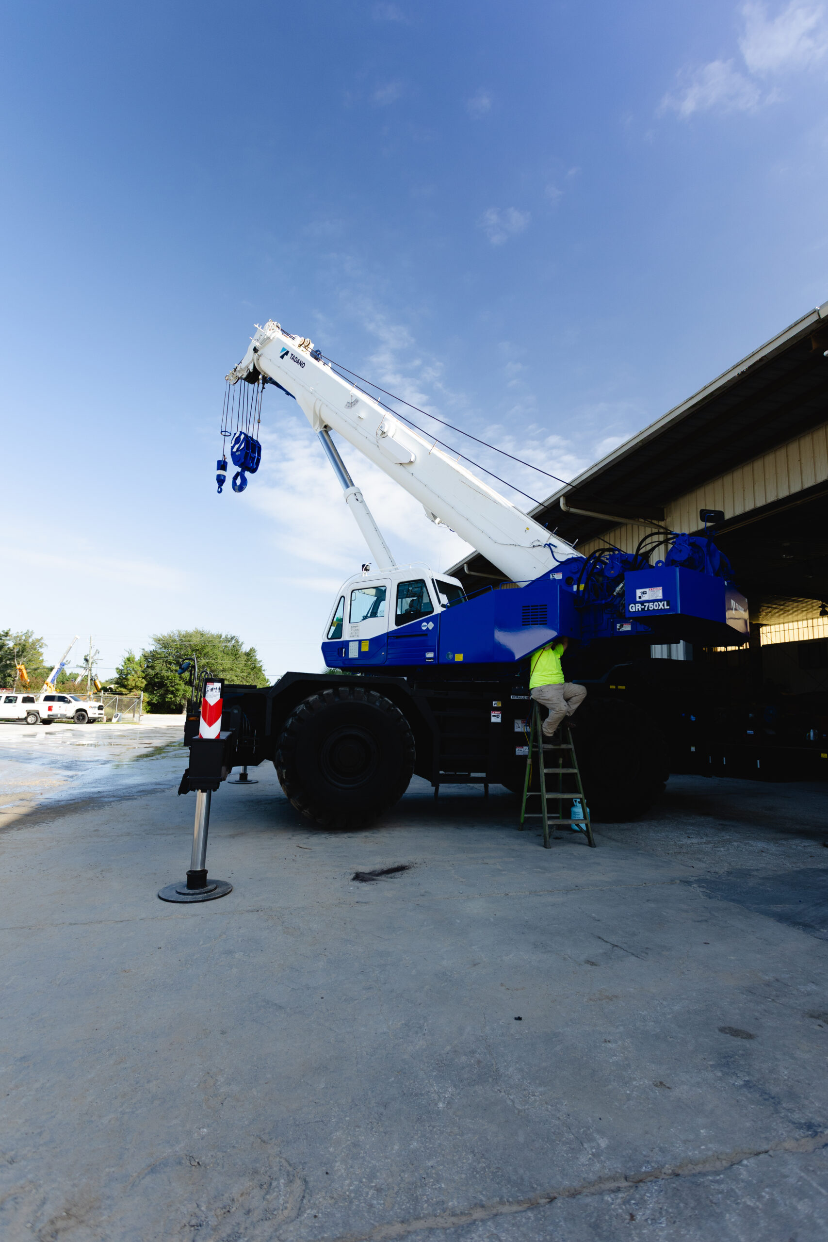 Dozier Crane employee working on a crane in the yard