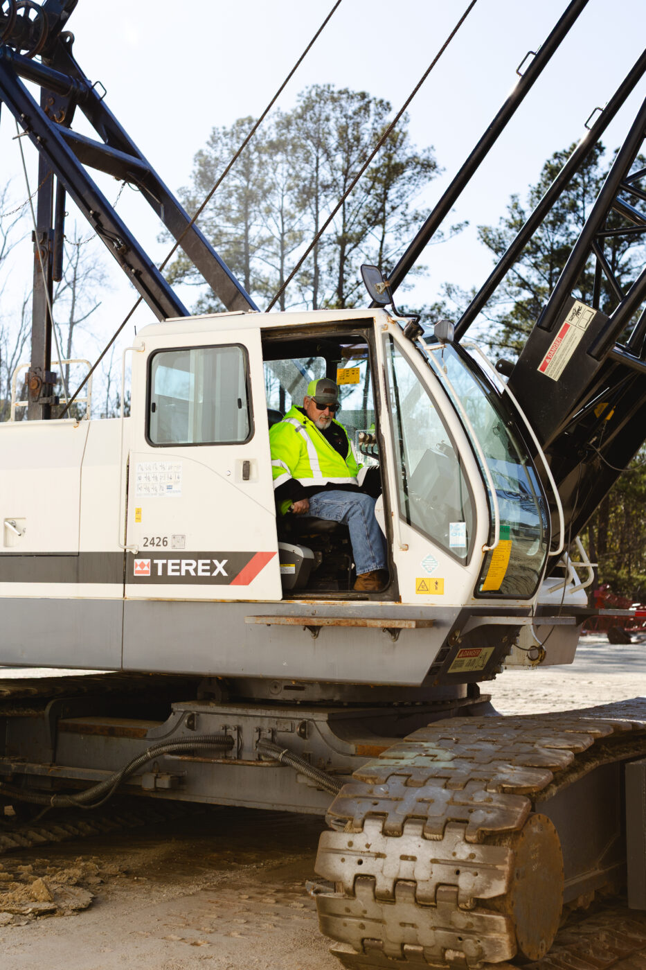 Dozier Crane master Mechanic Terry riding in a crane