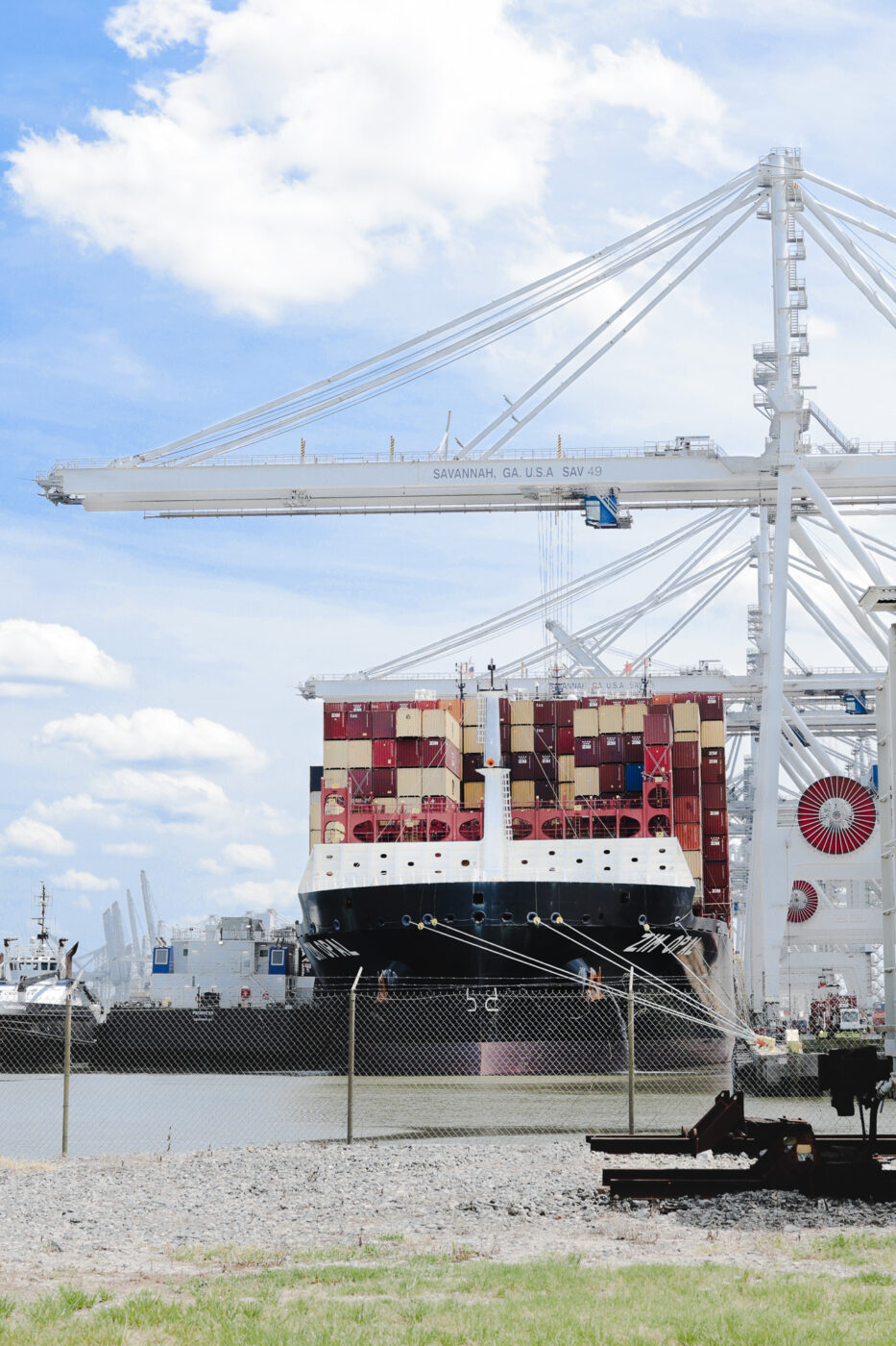 Cargo ship being loaded at a port